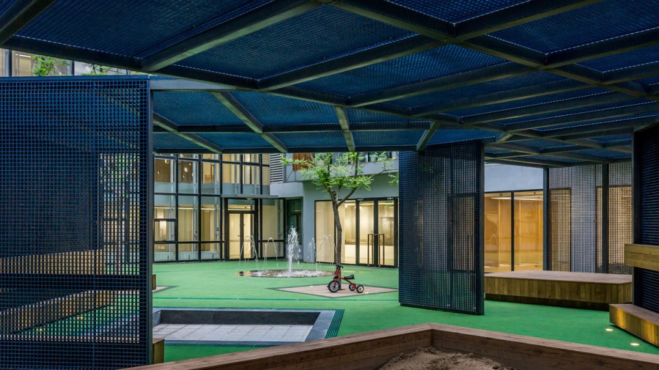 1 Central Yard_C Renovation of Tales CBD Kindergarten_Blue Yard by SPACEWORK Architects