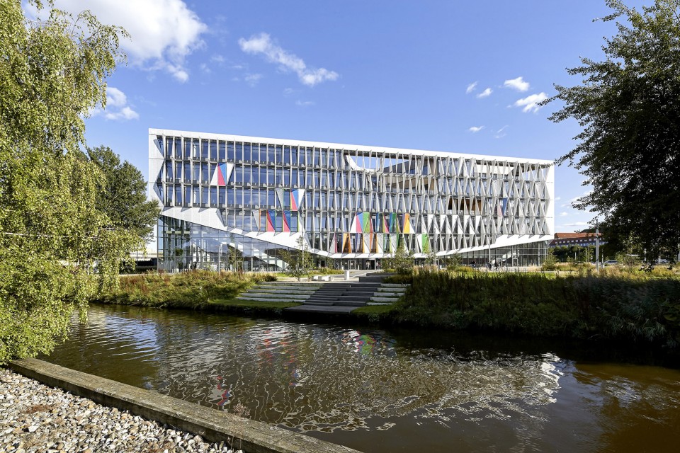 With its triangular shape, Campus Kolding of University of Southern Denmark creates a significant new landmark in Kolding. The building is located in Kolding, Denmark, and designed by Henning Larsen Architects. Photo by Hufton + Crow.