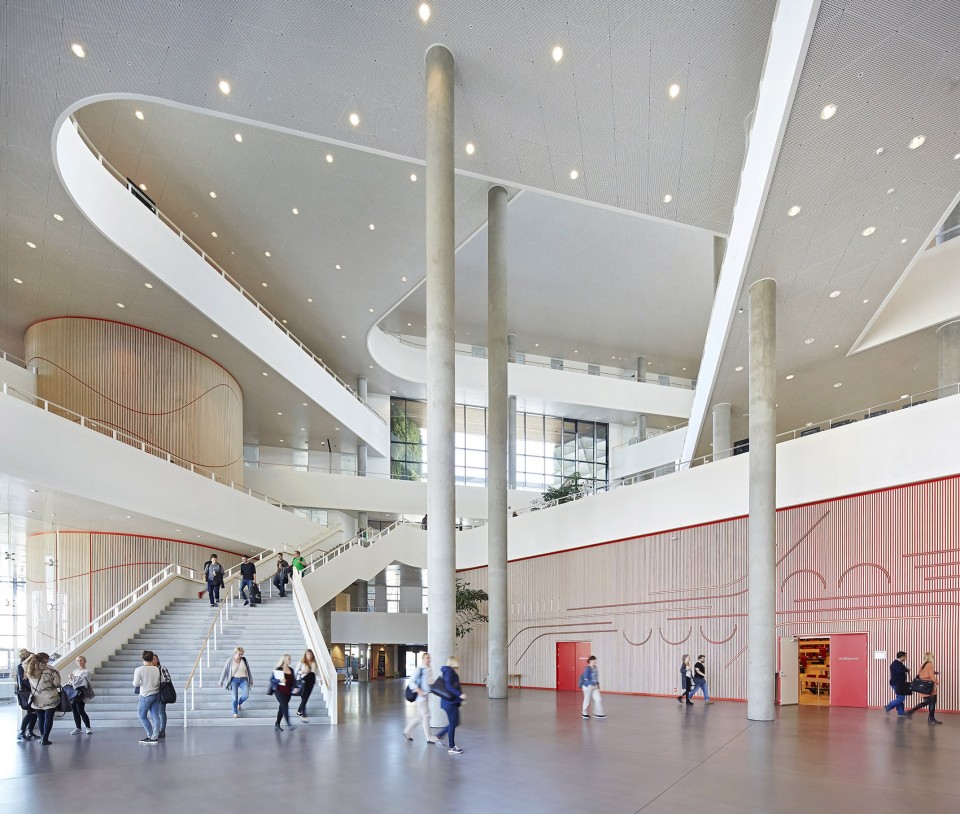 With its triangular shape, Campus Kolding of University of Southern Denmark creates a significant new landmark in Kolding. The building is located in Kolding, Denmark, and designed by Henning Larsen Architects. Photo by Hufton + Crow.