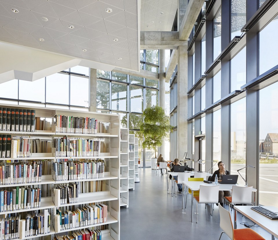 With its triangular shape, Campus Kolding of University of Southern Denmark creates a significant new landmark in Kolding. The building is located in Kolding, Denmark, and designed by Henning Larsen Architects. Photo by Hufton + Crow.