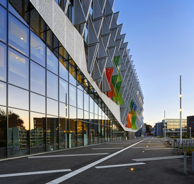 With its triangular shape, Campus Kolding of University of Southern Denmark creates a significant new landmark in Kolding. The building is located in Kolding, Denmark, and designed by Henning Larsen Architects. Photo by Hufton + Crow.