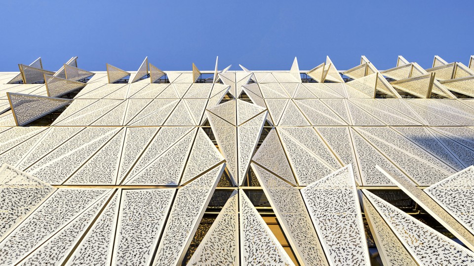 With its triangular shape, Campus Kolding of University of Southern Denmark creates a significant new landmark in Kolding. The building is located in Kolding, Denmark, and designed by Henning Larsen Architects. Photo by Hufton + Crow.