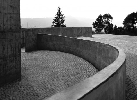 14- A solitary rough concrete monument rises from destruction, China by West-line studio