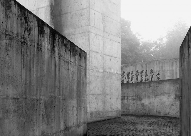 16- A solitary rough concrete monument rises from destruction, China by West-line studio