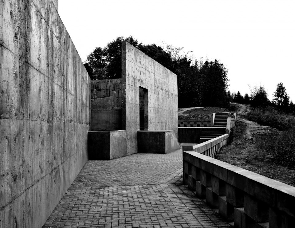 18- A solitary rough concrete monument rises from destruction, China by West-line studio