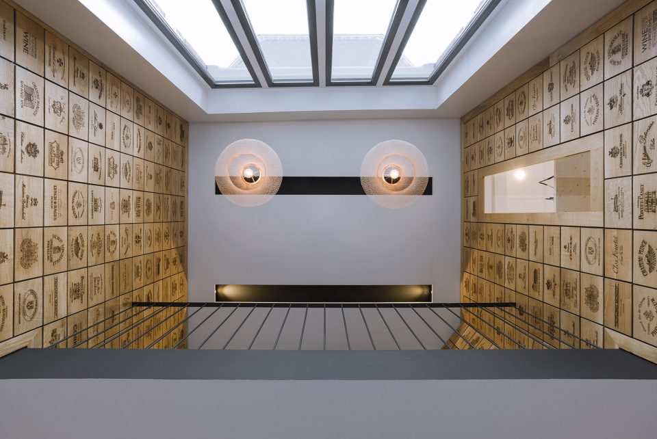 Wineshop Clad with 2100 Engraved Oak Panels