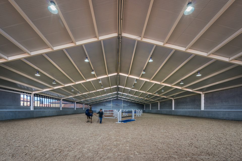 Horse Ridding Field in Cattle Farm by OOIIO Architecture