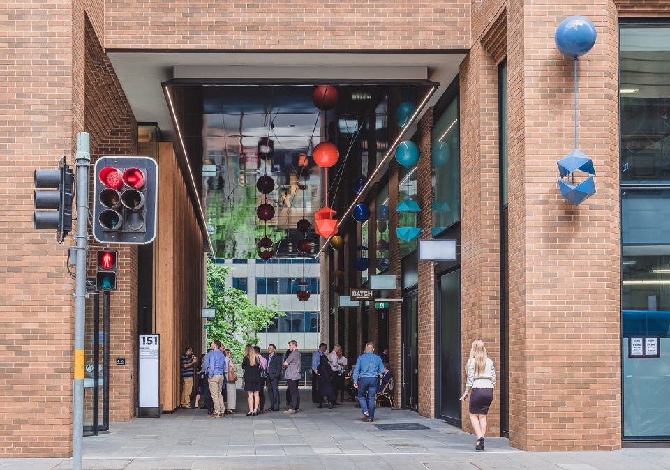 delicate and playful sculptures hang mid air in pedestrian walkway by uap