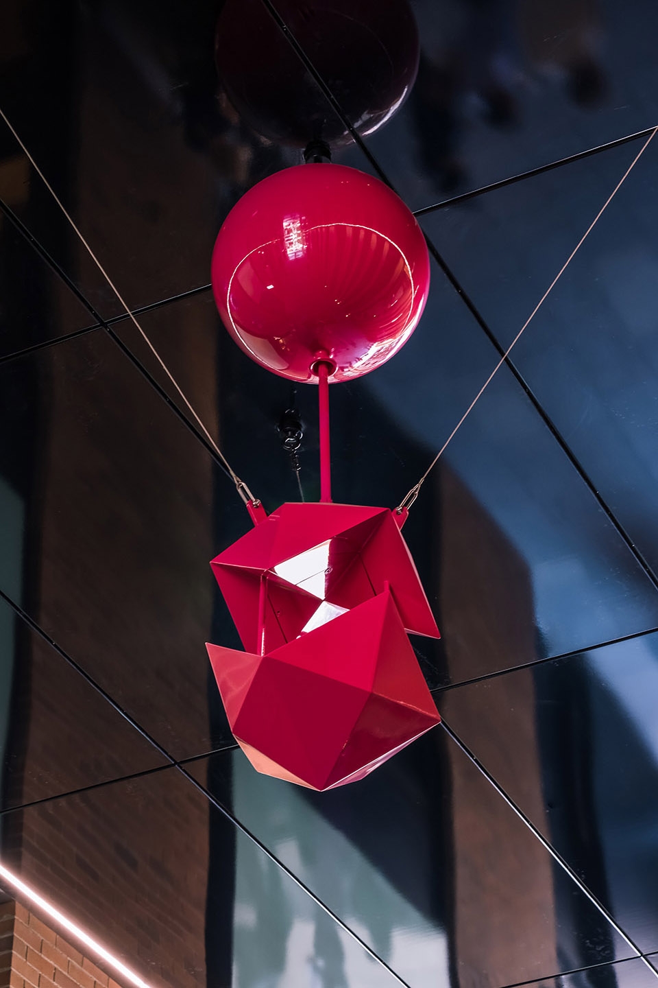 delicate and playful sculptures hang mid air in pedestrian walkway by uap 1