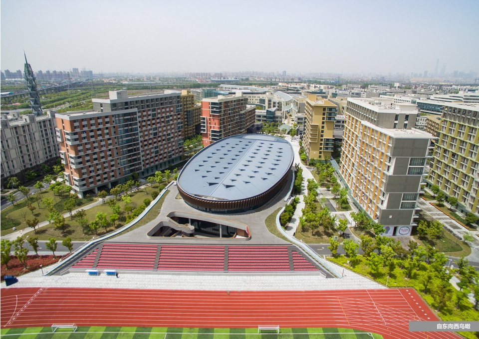 a living fish swimming in the campus design of the sports hall of shanghai university of science and technology china by tjad