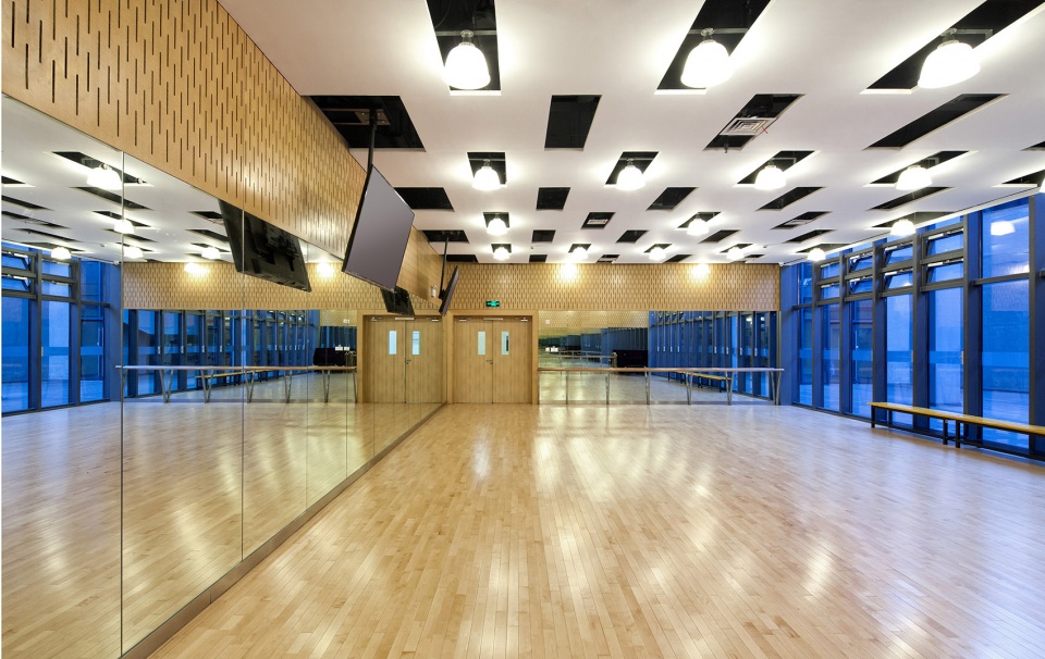 a living fish swimming in the campus design of the sports hall of shanghai university of science and technology china by tjad