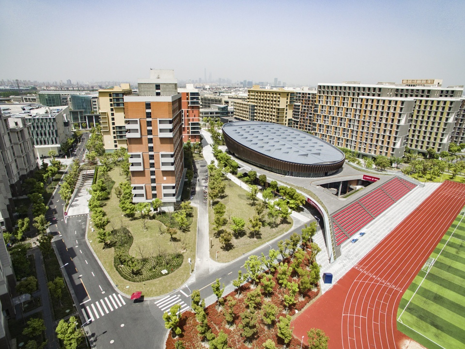 a living fish swimming in the campus design of the sports hall of shanghai university of science and technology china by tjad