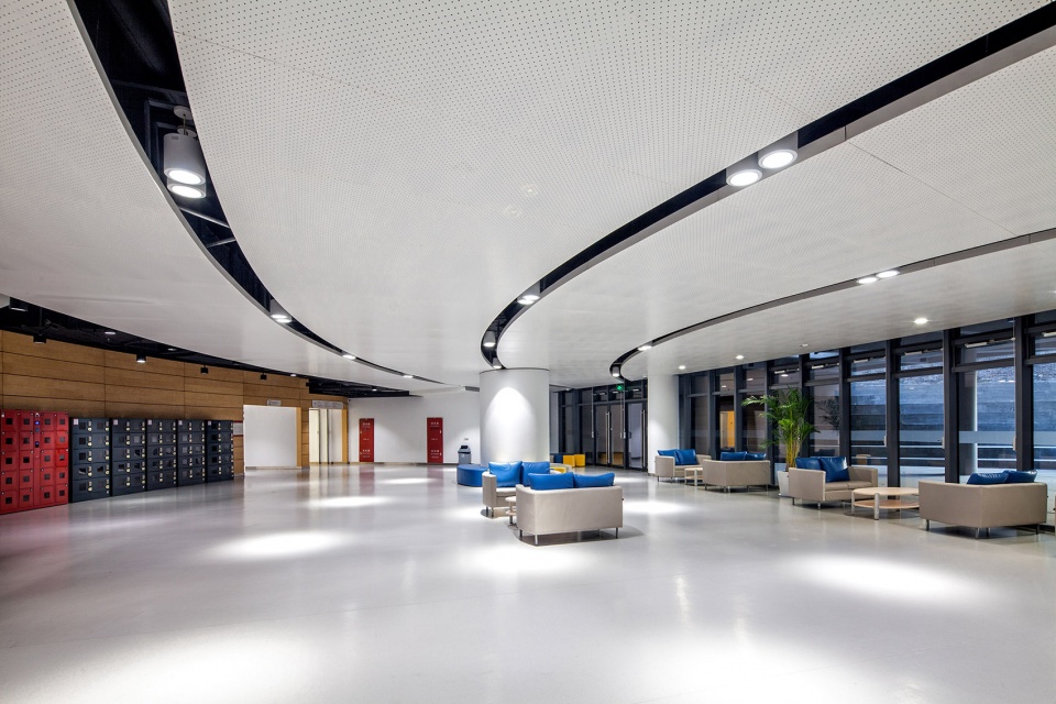 a living fish swimming in the campus design of the sports hall of shanghai university of science and technology china by tjad