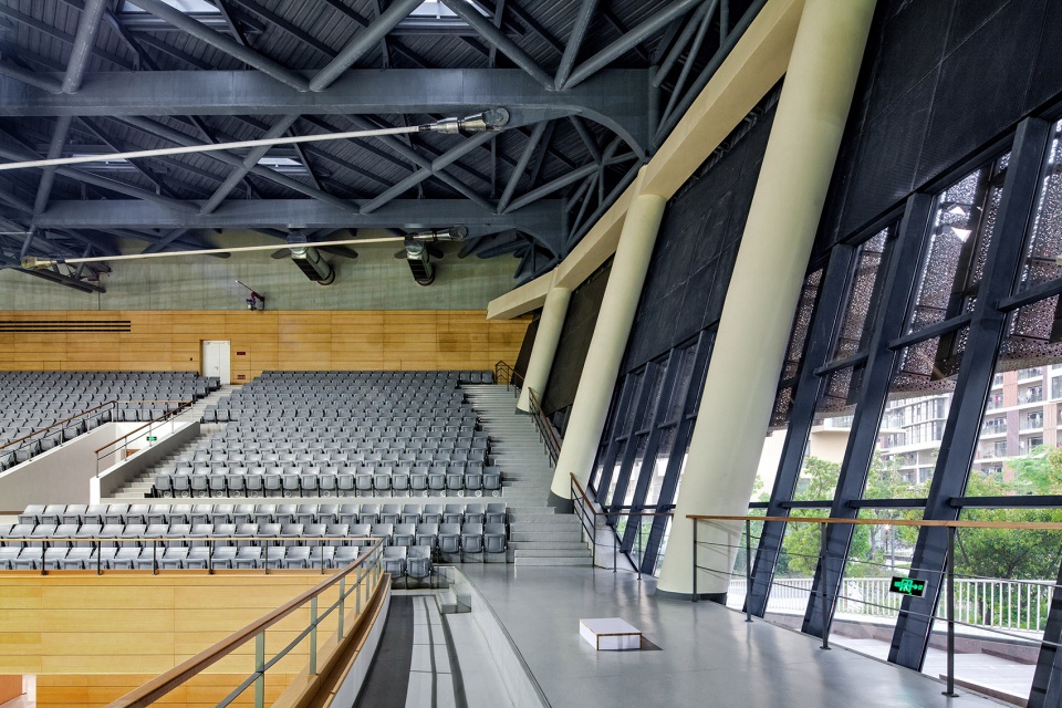 a living fish swimming in the campus design of the sports hall of shanghai university of science and technology china by tjad