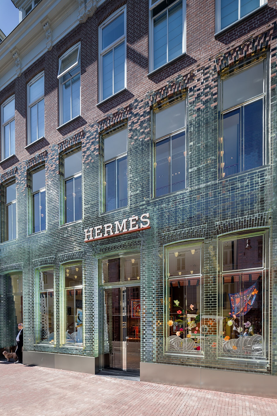 mvrdvs crystal houses hosting new tenant hermes re opens with an even more transparent facade