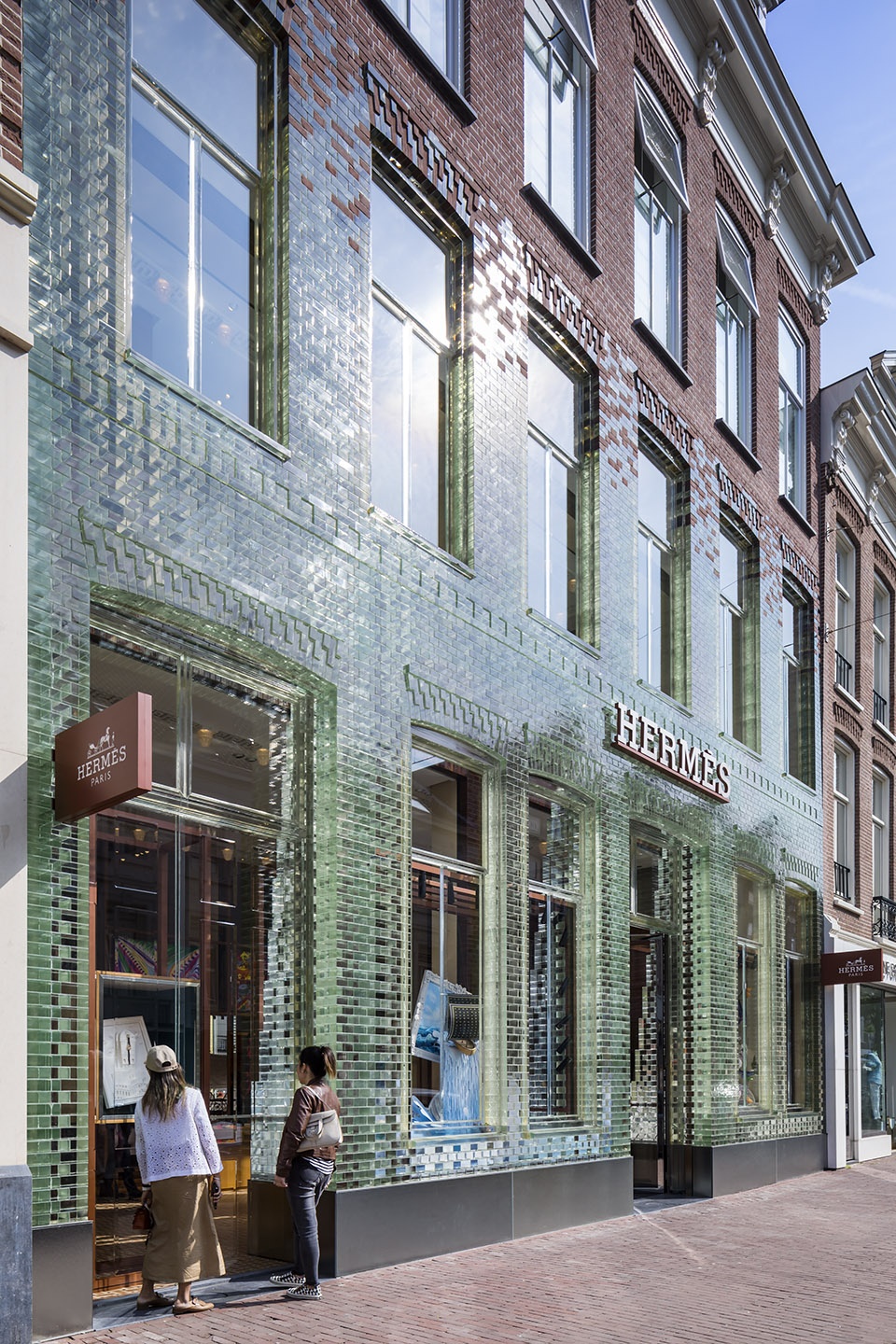 mvrdvs crystal houses hosting new tenant hermes re opens with an even more transparent facade