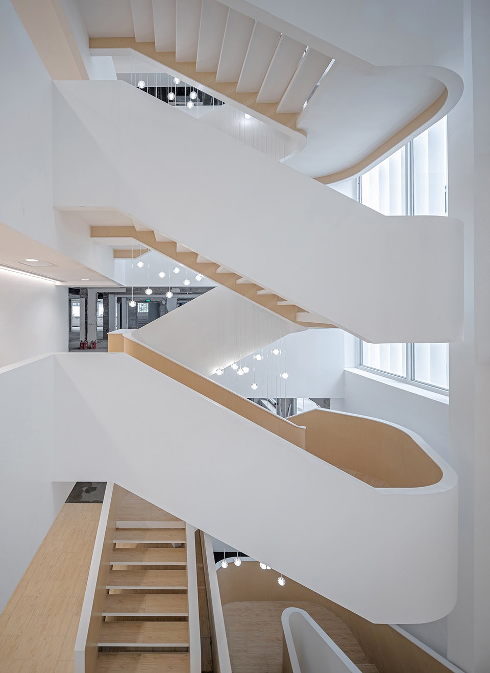 soften the presence renovation of jingan business building china by archunits
