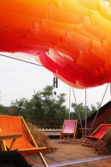 a little nap under the sunset installation by abandoned city bigrice design