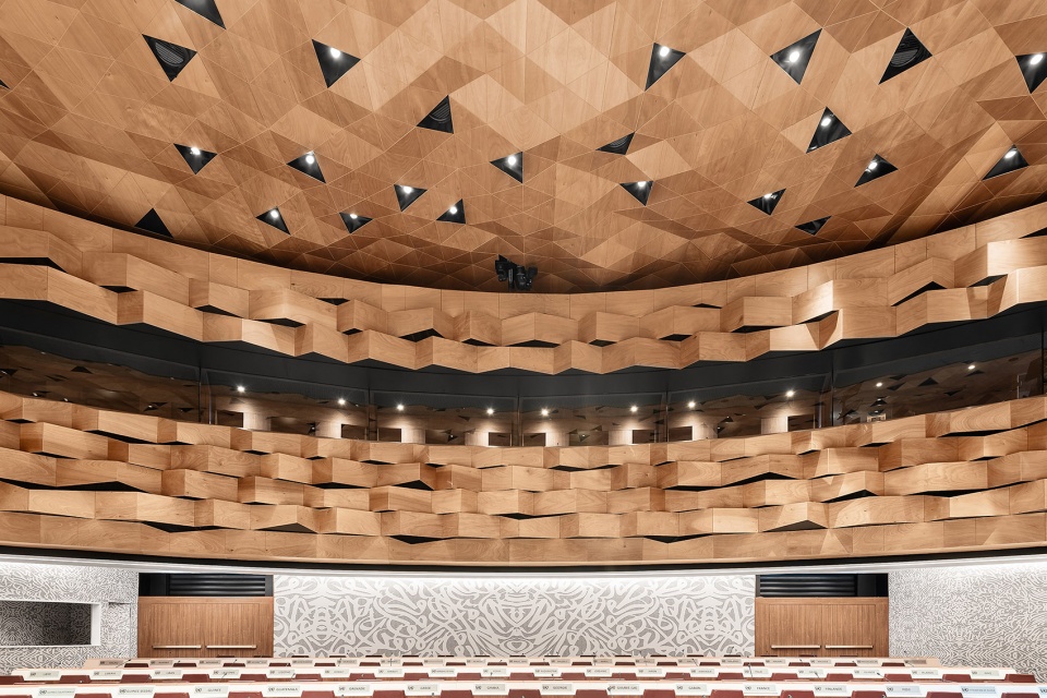 wood skin covers the dome and walls of the new assembly hall of the united nations palace in geneva