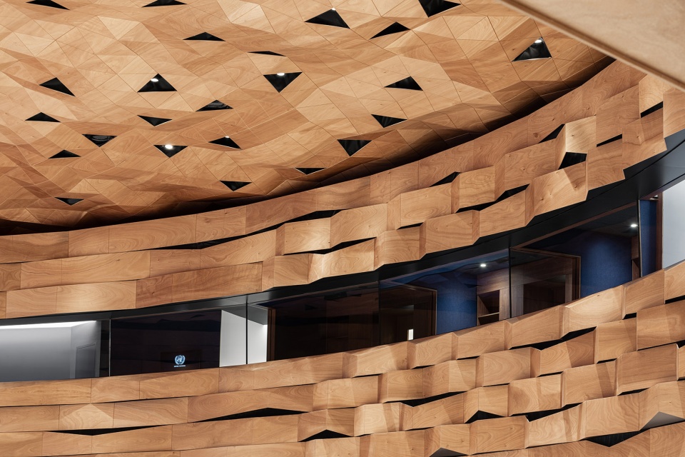wood skin covers the dome and walls of the new assembly hall of the united nations palace in geneva