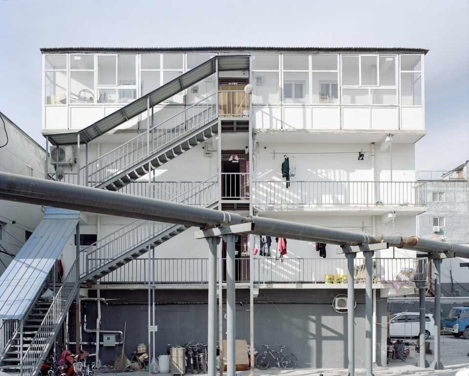 facades of village in the city by sun haiting