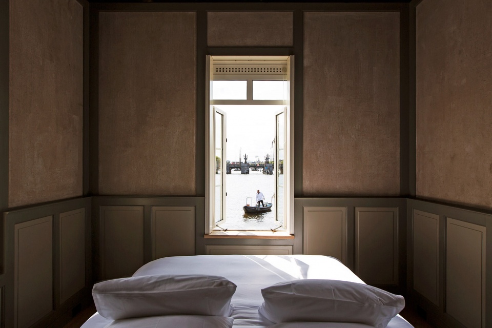 sweets hotel transforms amsterdams former bridge houses into independent hotel rooms