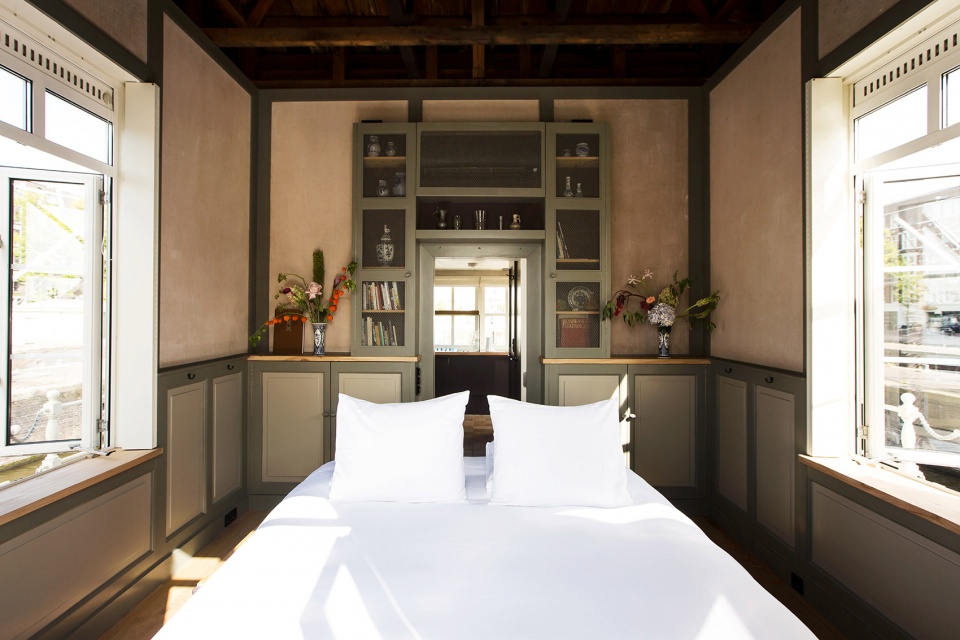 sweets hotel transforms amsterdams former bridge houses into independent hotel rooms