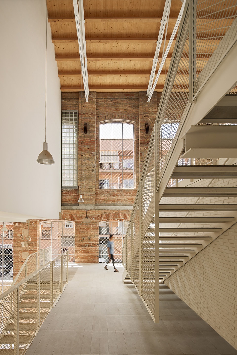 Transformation of the old thread storage building in a social housing complex by Roldan Berengue