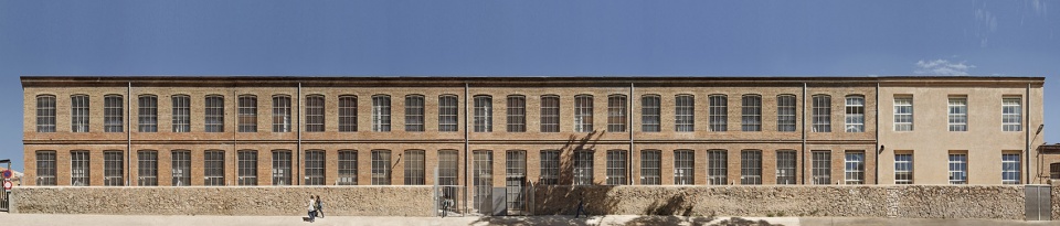 Transformation of the old thread storage building in a social housing complex by Roldan Berengue