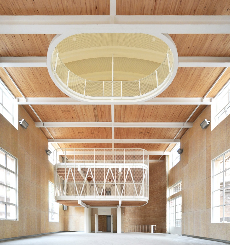 Transformation of the old thread storage building in a social housing complex by Roldan Berengue