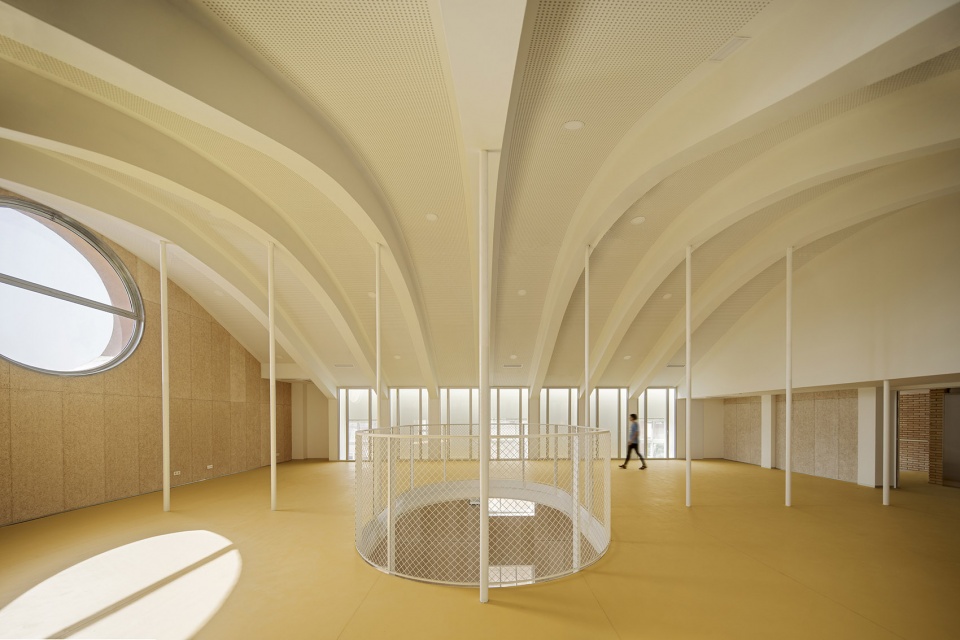 Transformation of the old thread storage building in a social housing complex by Roldan Berengue