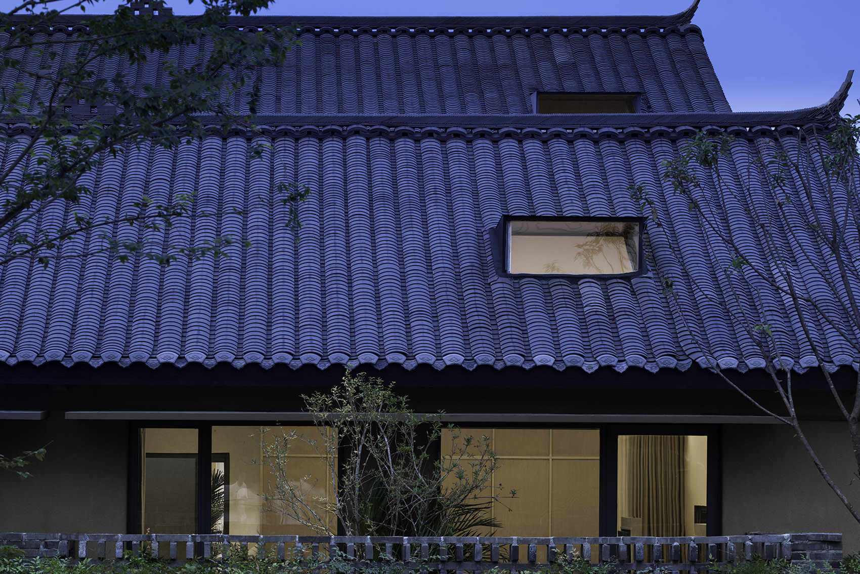Pretty lodges built in mountains layering courtyard China by CC ARCHITECTURE SPACE