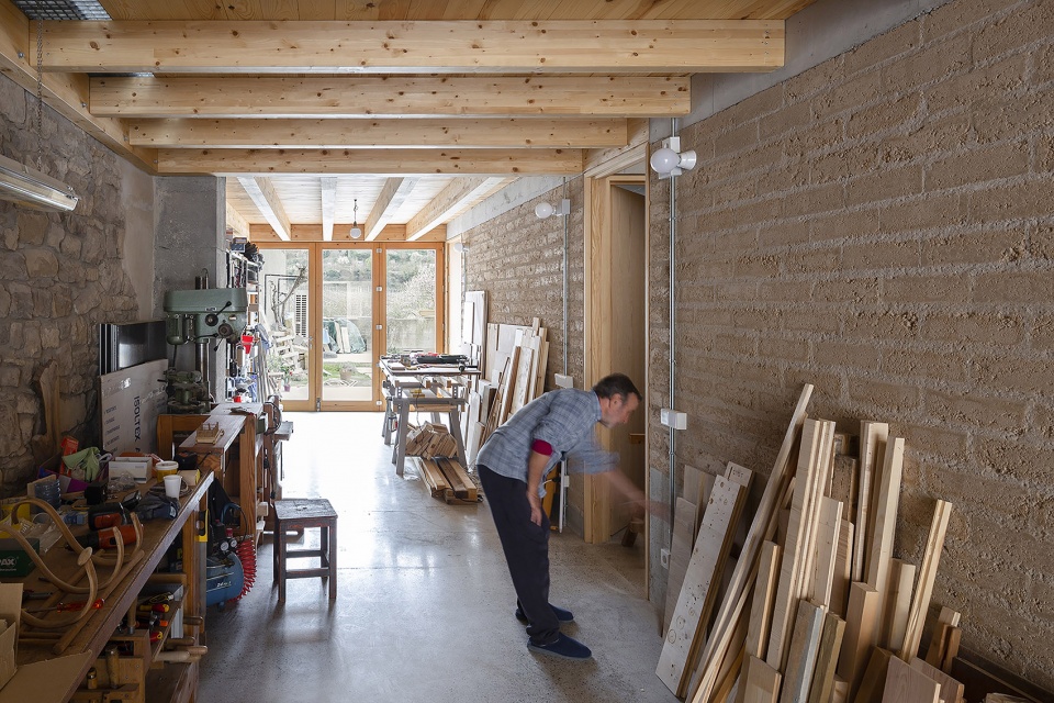 conversion of agricultural warehouse to senior cohousing spain by arqbag