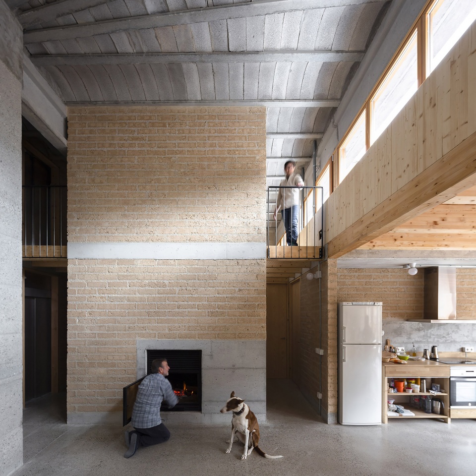 conversion of agricultural warehouse to senior cohousing spain by arqbag