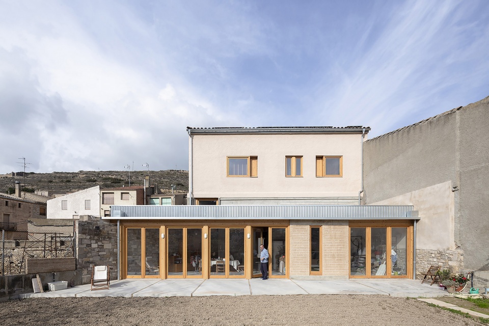 conversion of agricultural warehouse to senior cohousing spain by arqbag