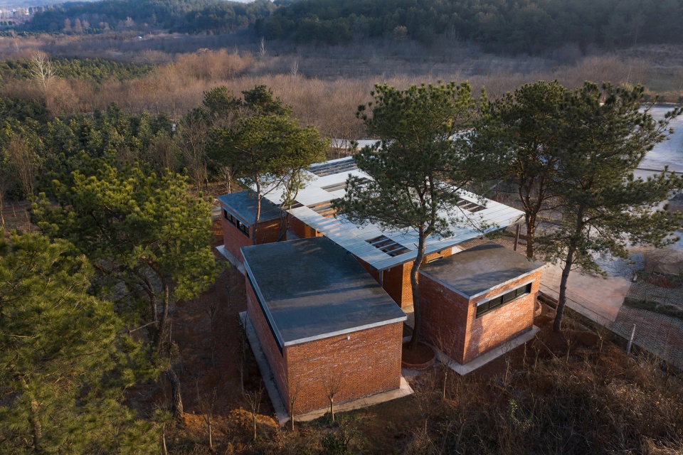 the courtyard memory of miniature architecture design of public toilet of a hundred square meter for rural tourism in wuhan china by uao...