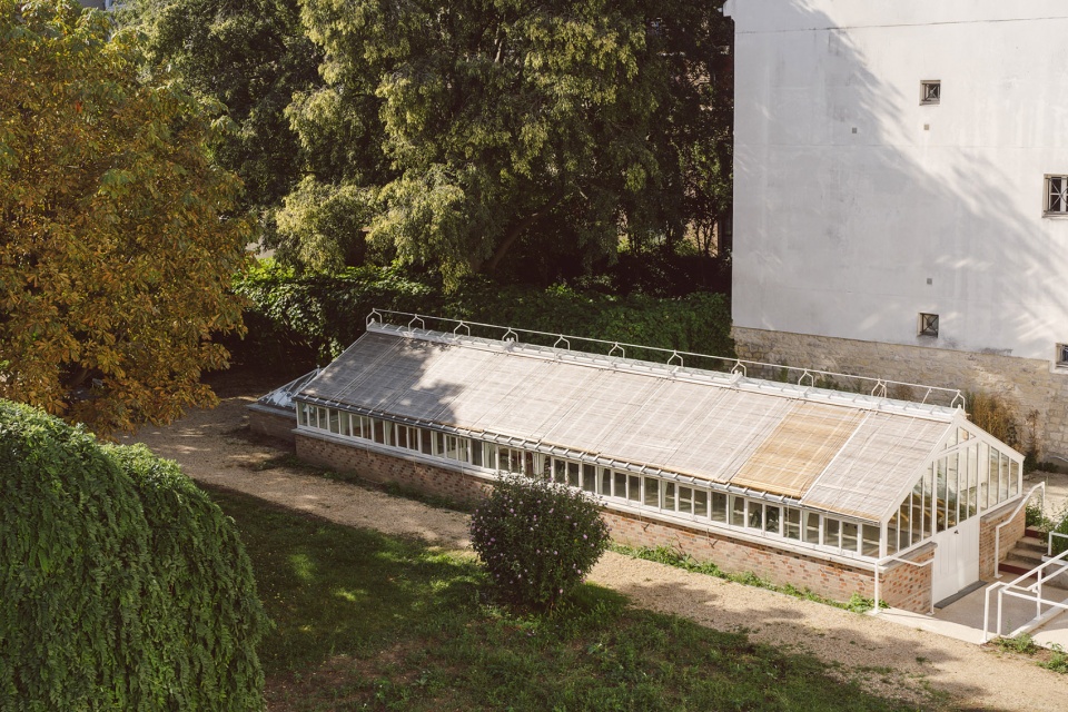 horticultural greenhouse converted into hospitality room by forme architecture urbanisme
