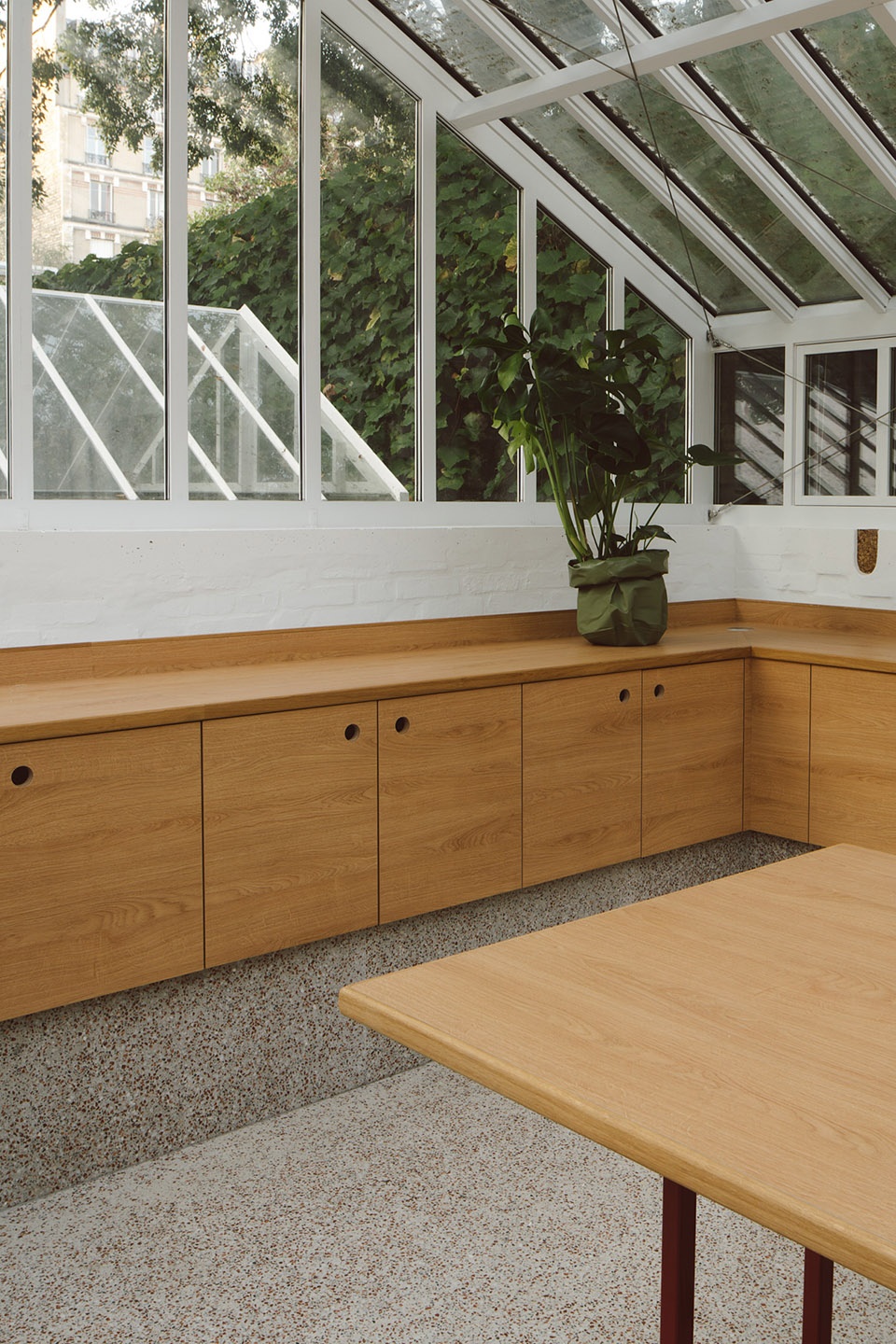 horticultural greenhouse converted into hospitality room by forme architecture urbanisme
