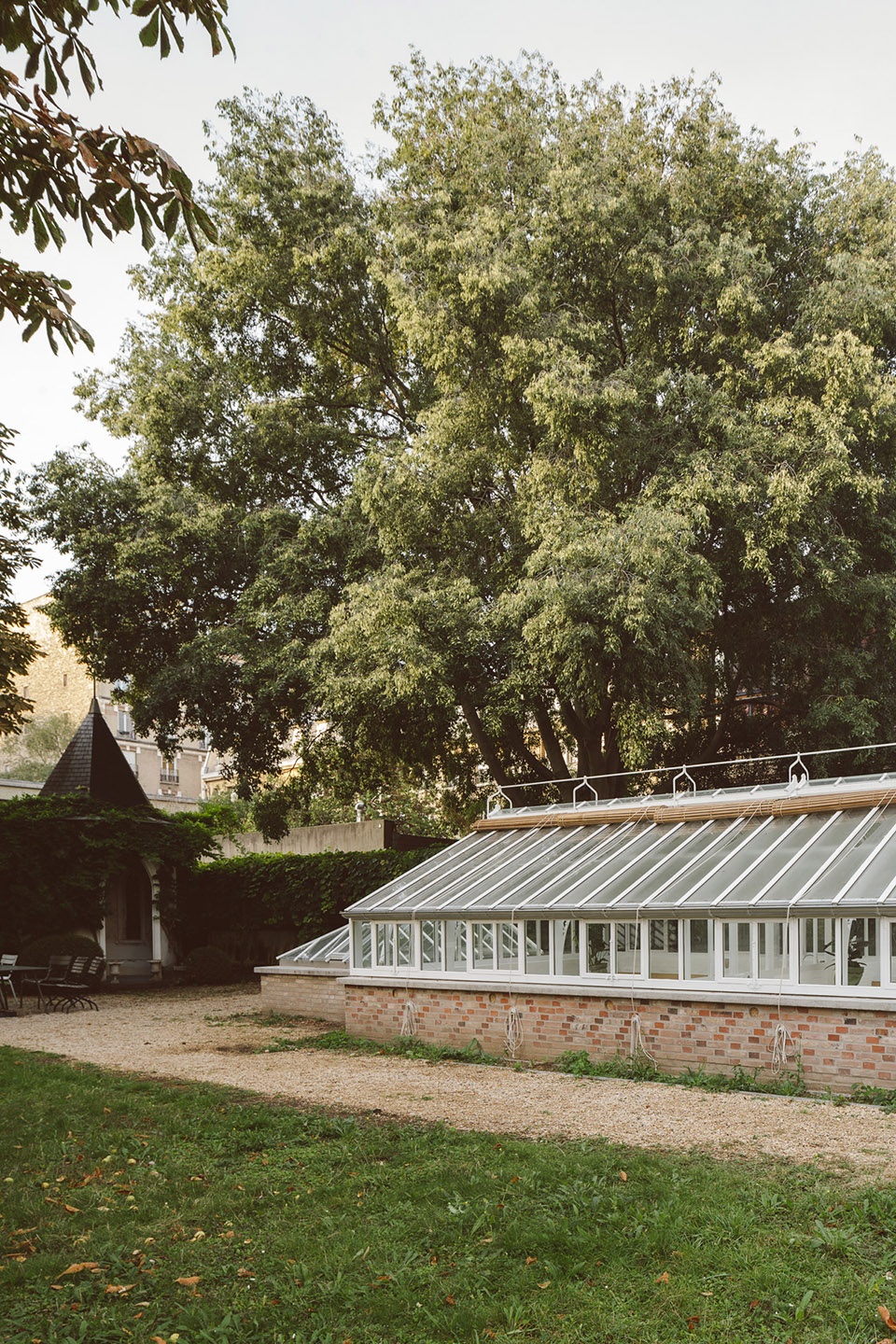 horticultural greenhouse converted into hospitality room by forme architecture urbanisme