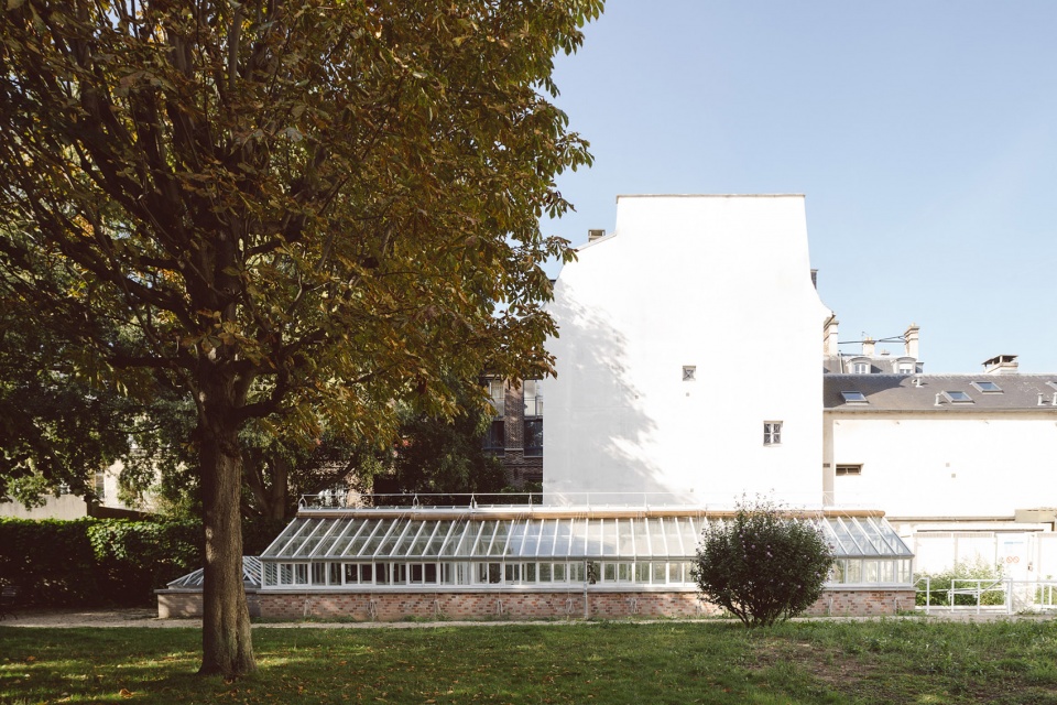 horticultural greenhouse converted into hospitality room by forme architecture urbanisme