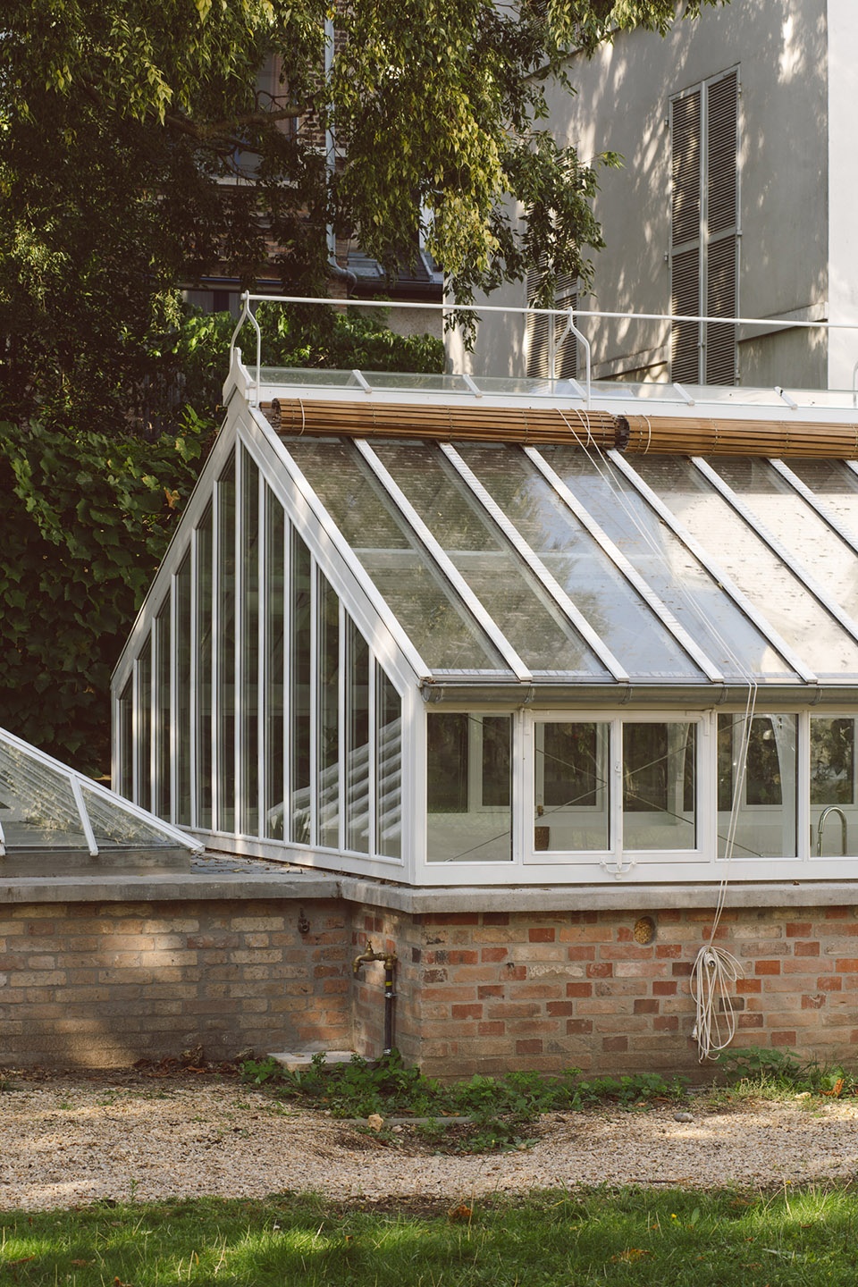 horticultural greenhouse converted into hospitality room by forme architecture urbanisme