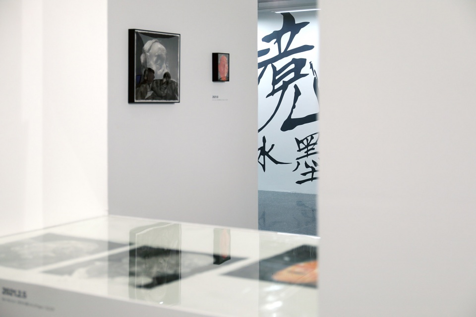 exhibition design of wonderland fang lijun ink painting by swallowtail design