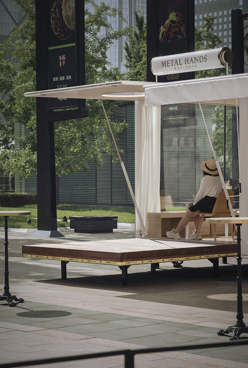 wandering metal hands coffee drives camping coffee car into china world trade center beijing by daga architects