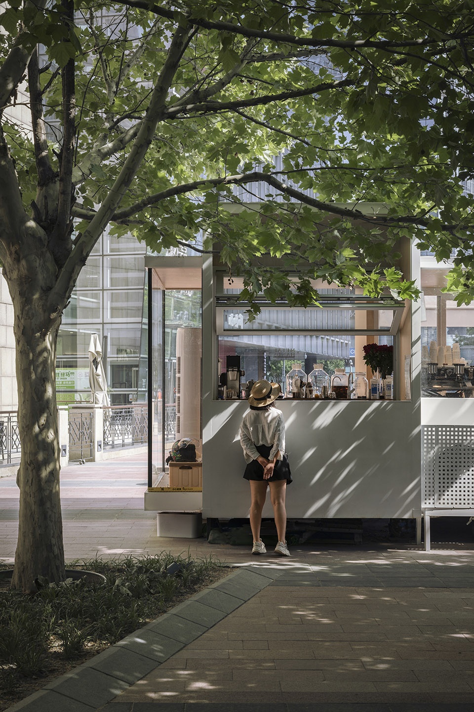 wandering metal hands coffee drives camping coffee car into china world trade center beijing by daga architects
