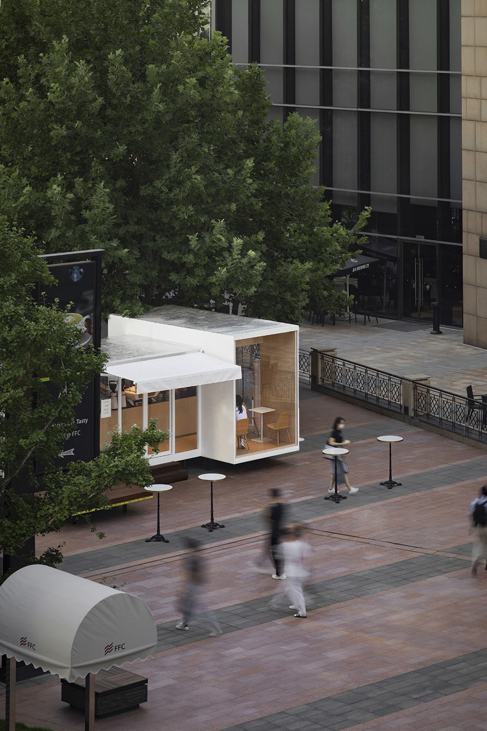 wandering metal hands coffee drives camping coffee car into china world trade center beijing by daga architects