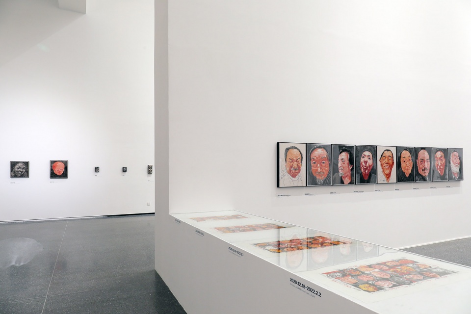 exhibition design of wonderland fang lijun ink painting by swallowtail design