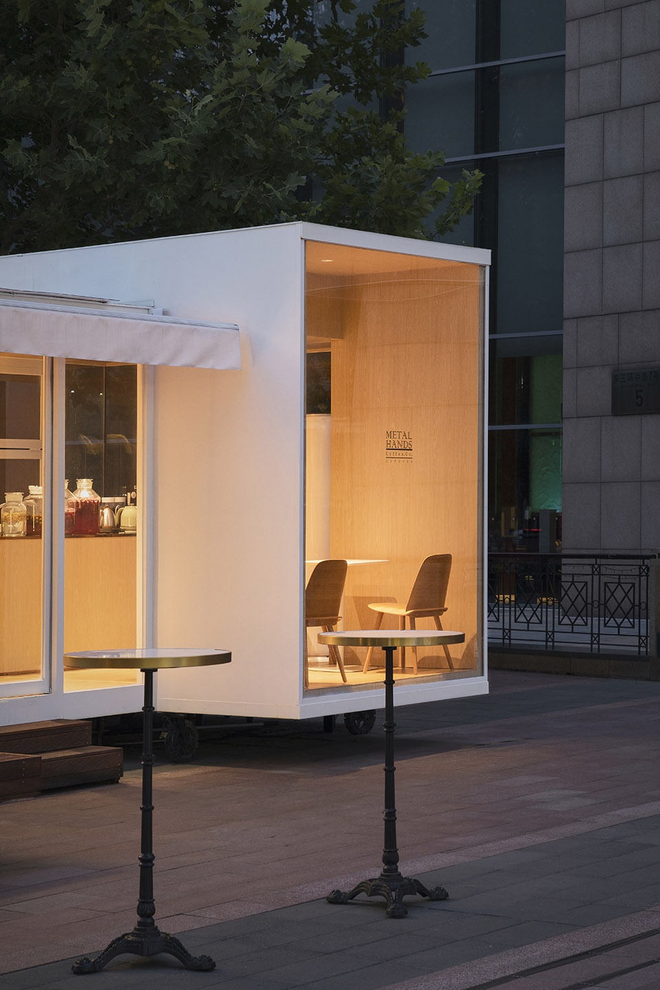 wandering metal hands coffee drives camping coffee car into china world trade center beijing by daga architects