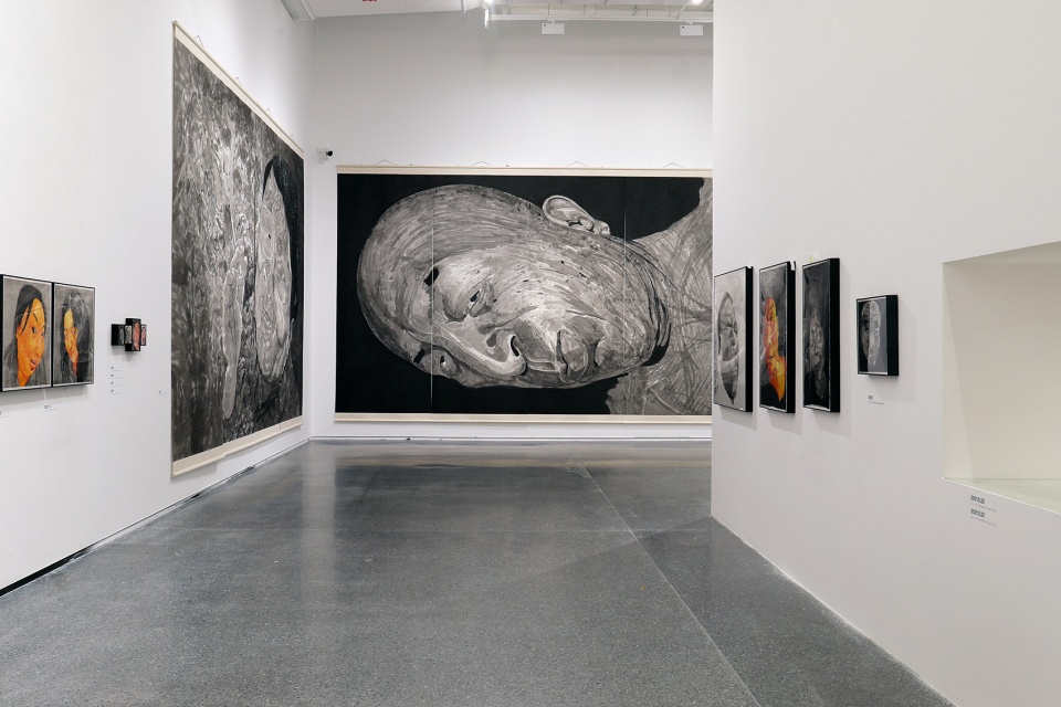 exhibition design of wonderland fang lijun ink painting by swallowtail design