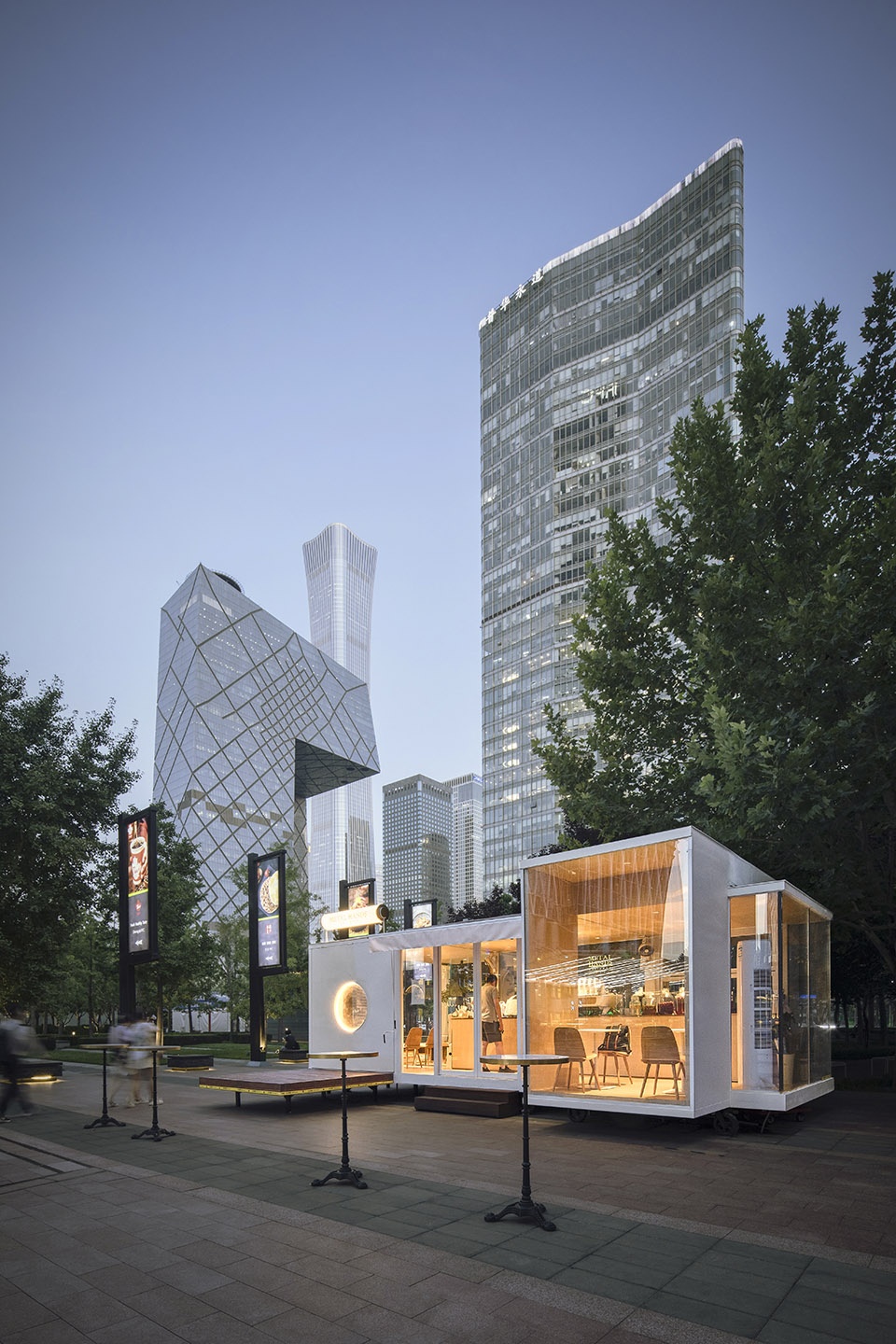 wandering metal hands coffee drives camping coffee car into china world trade center beijing by daga architects