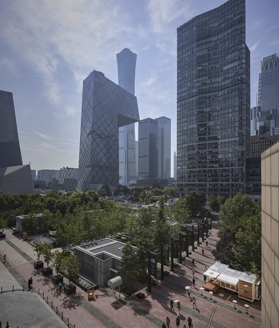 wandering metal hands coffee drives camping coffee car into china world trade center beijing by daga architects